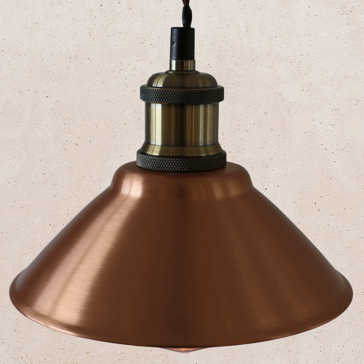 Vintage-style copper pendant light with a beige background