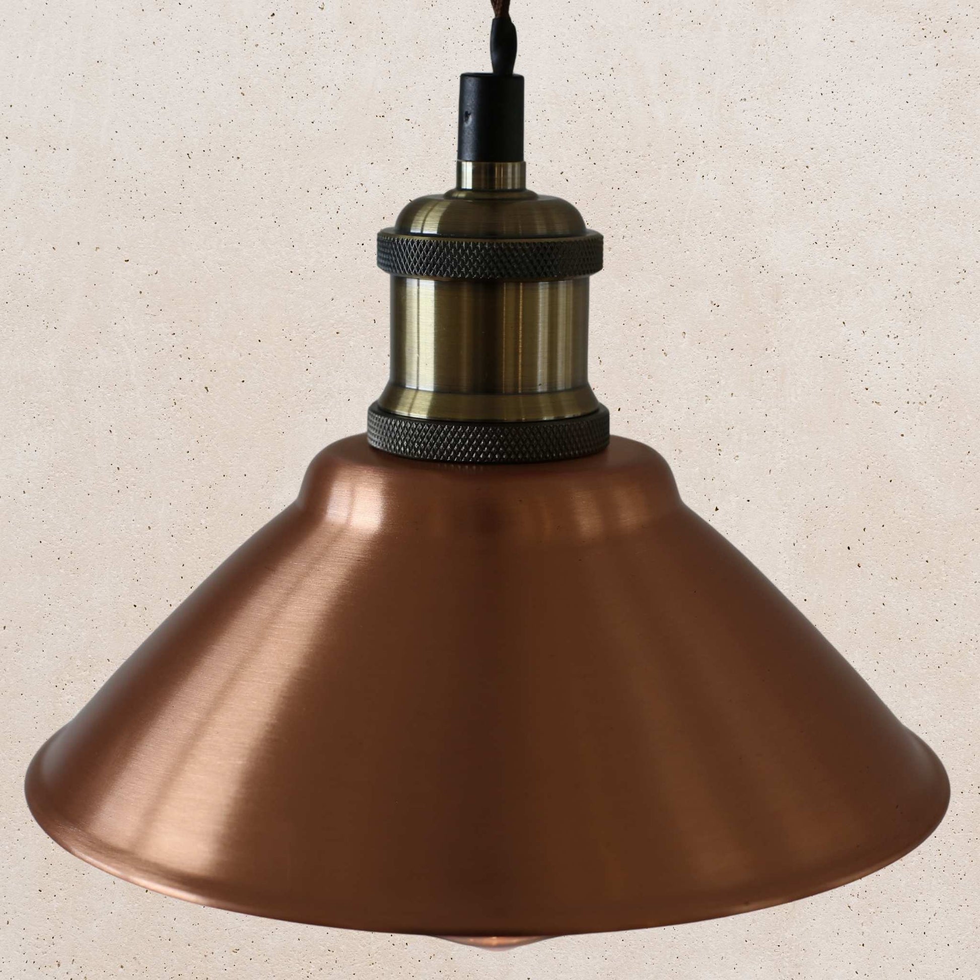 Vintage-style copper pendant light with a beige background