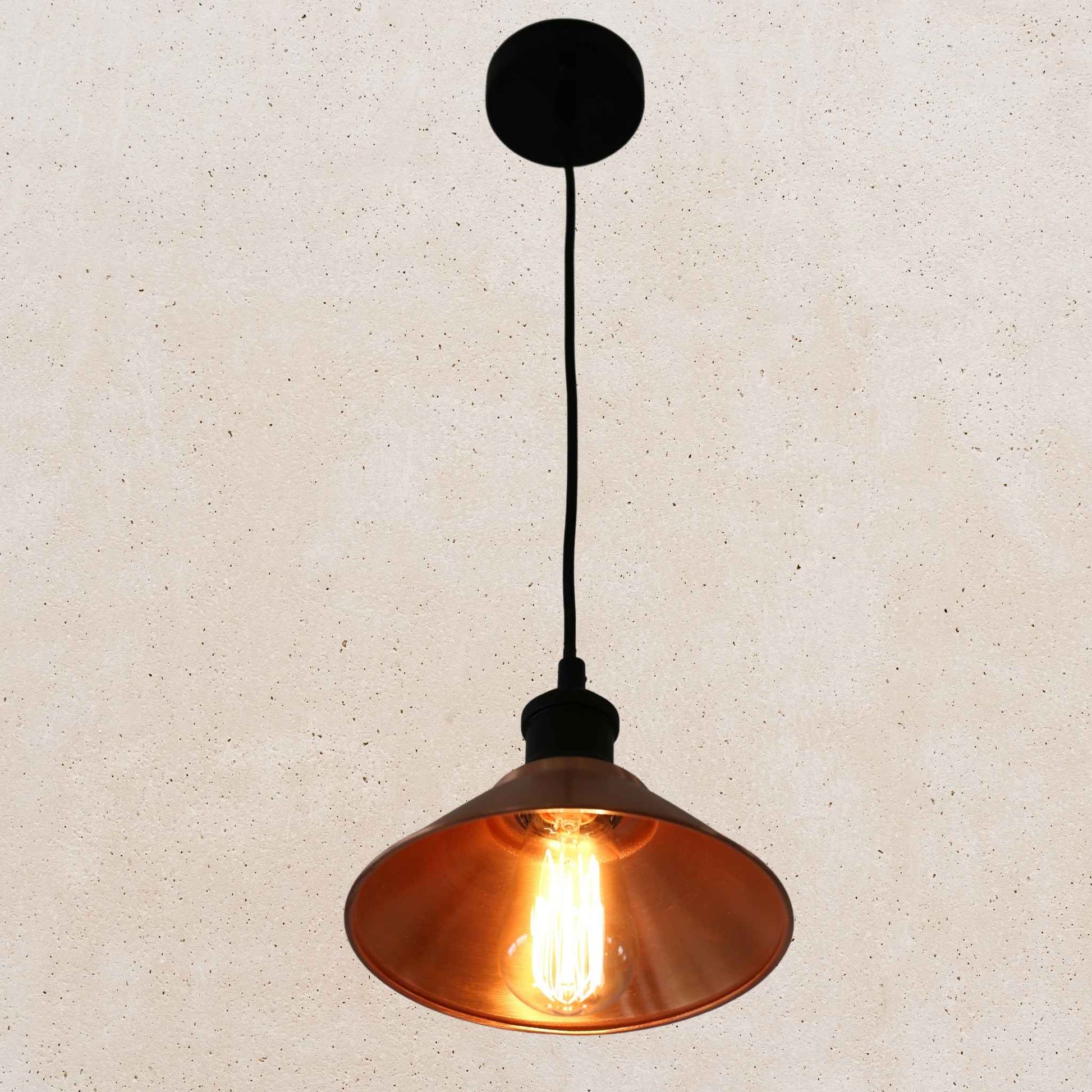 Vintage-style copper pendant light with a beige background