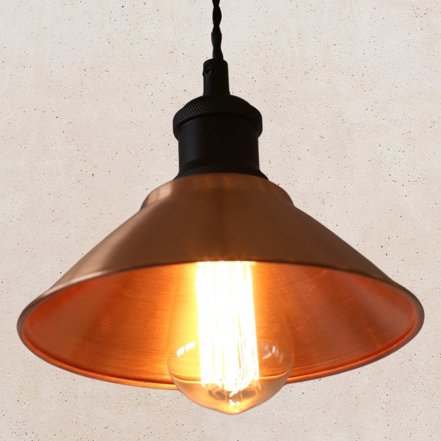 Vintage-style copper pendant light with a beige background