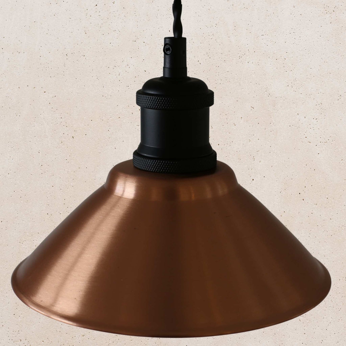Vintage-style copper pendant light with a beige background