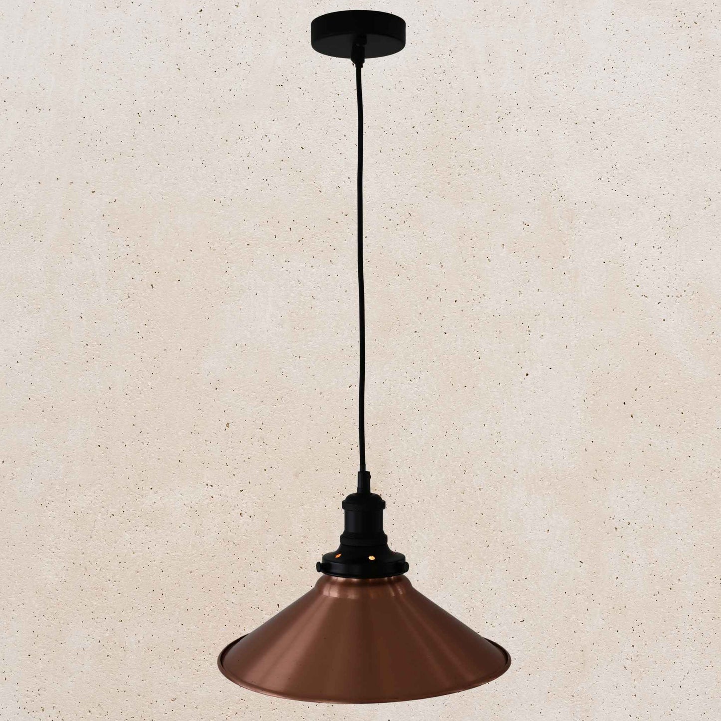 Copper pendant light on a beige background