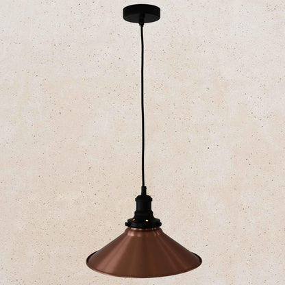 Copper pendant light on a beige background