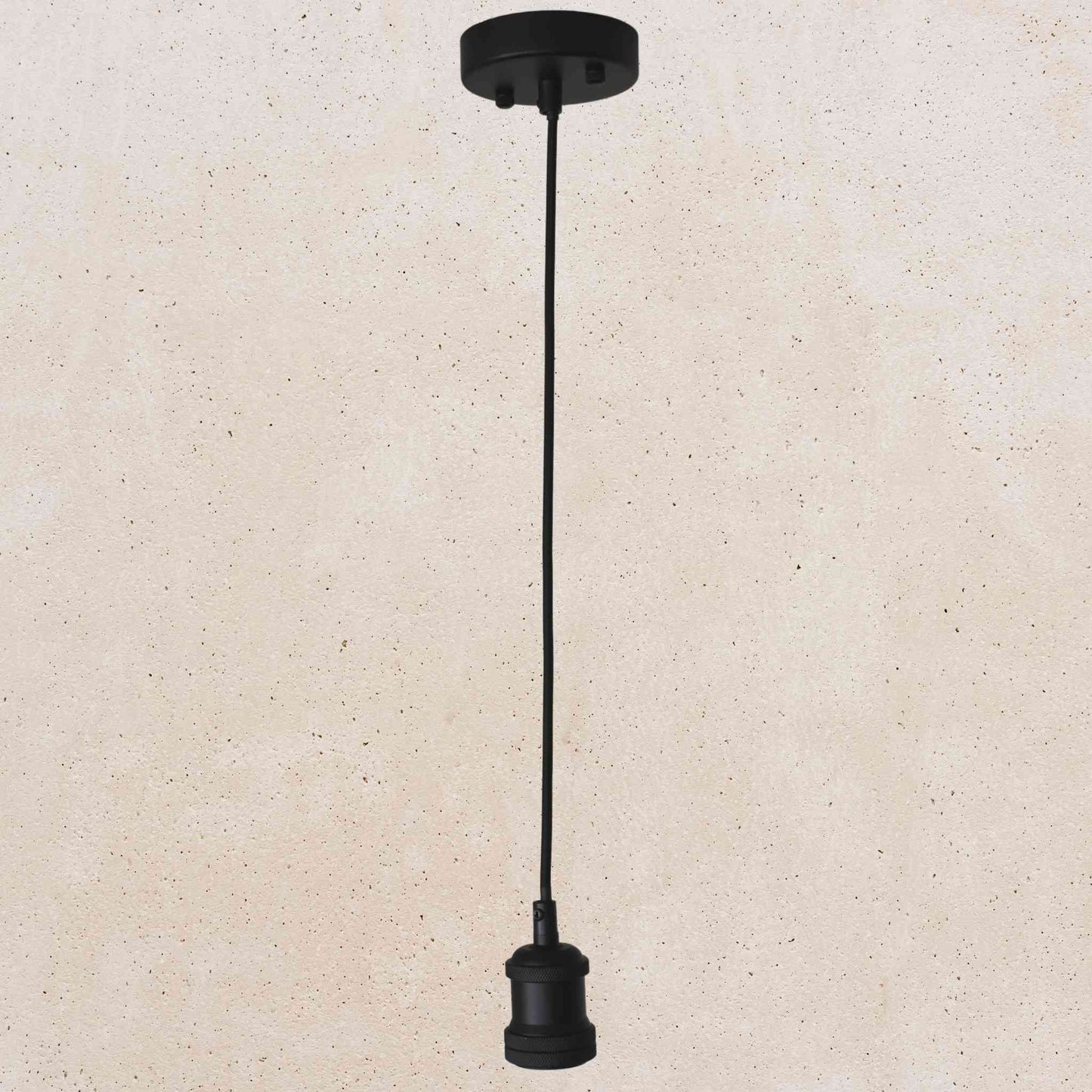 Black pendant light fixture on a beige background