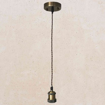 Bronze pendant light fixture on a beige speckled background