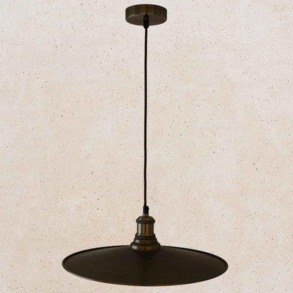 Antique brass pendant light fixture on a beige background