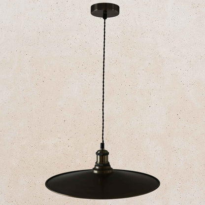 Antique brass pendant light fixture on a beige background