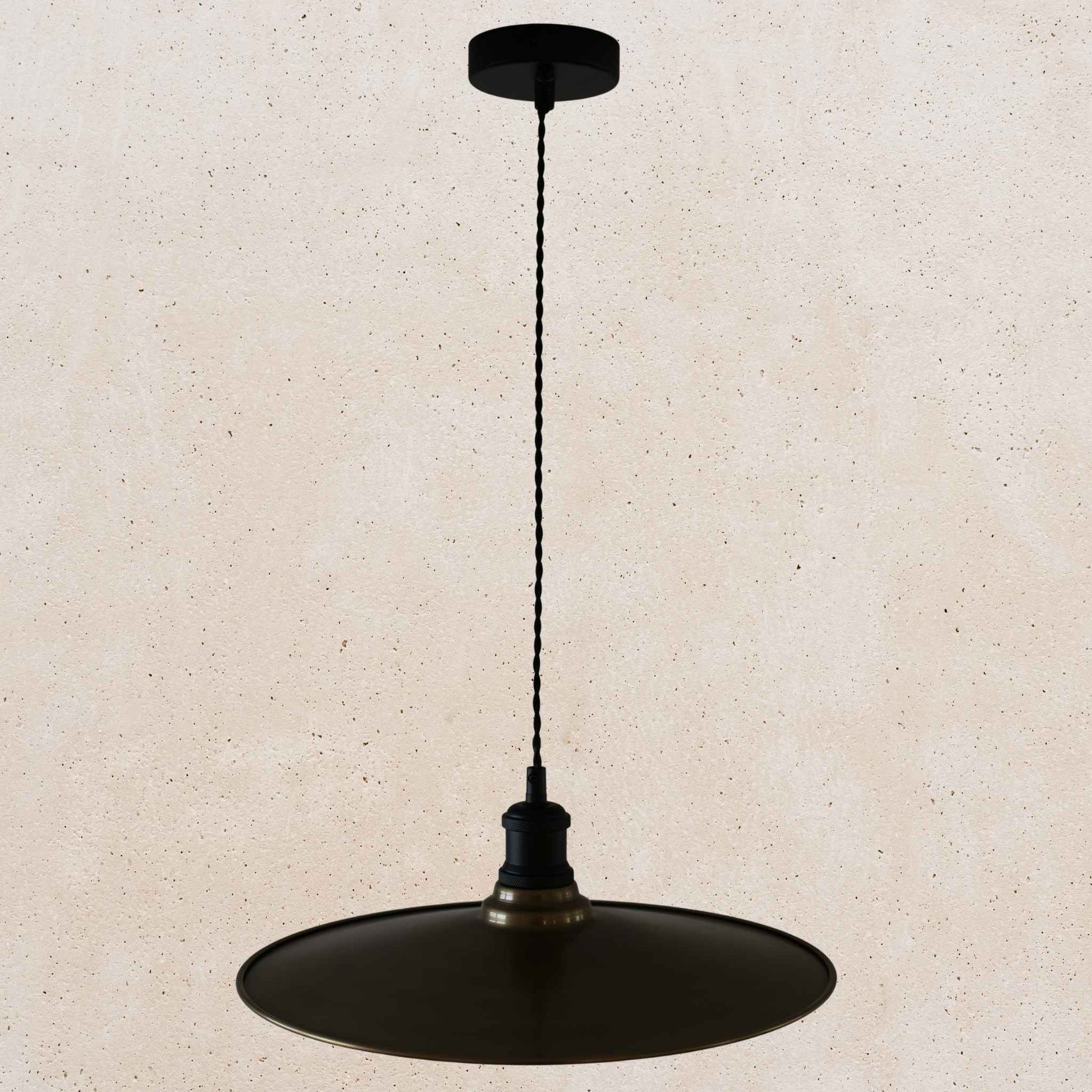 Antique brass pendant light fixture on a beige background