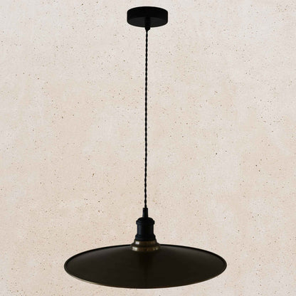 Antique brass pendant light fixture on a beige background