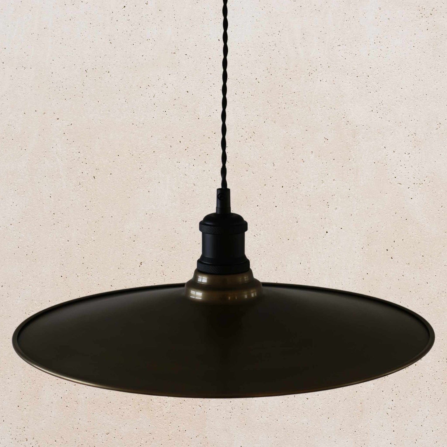 Antique brass pendant light fixture on a beige background