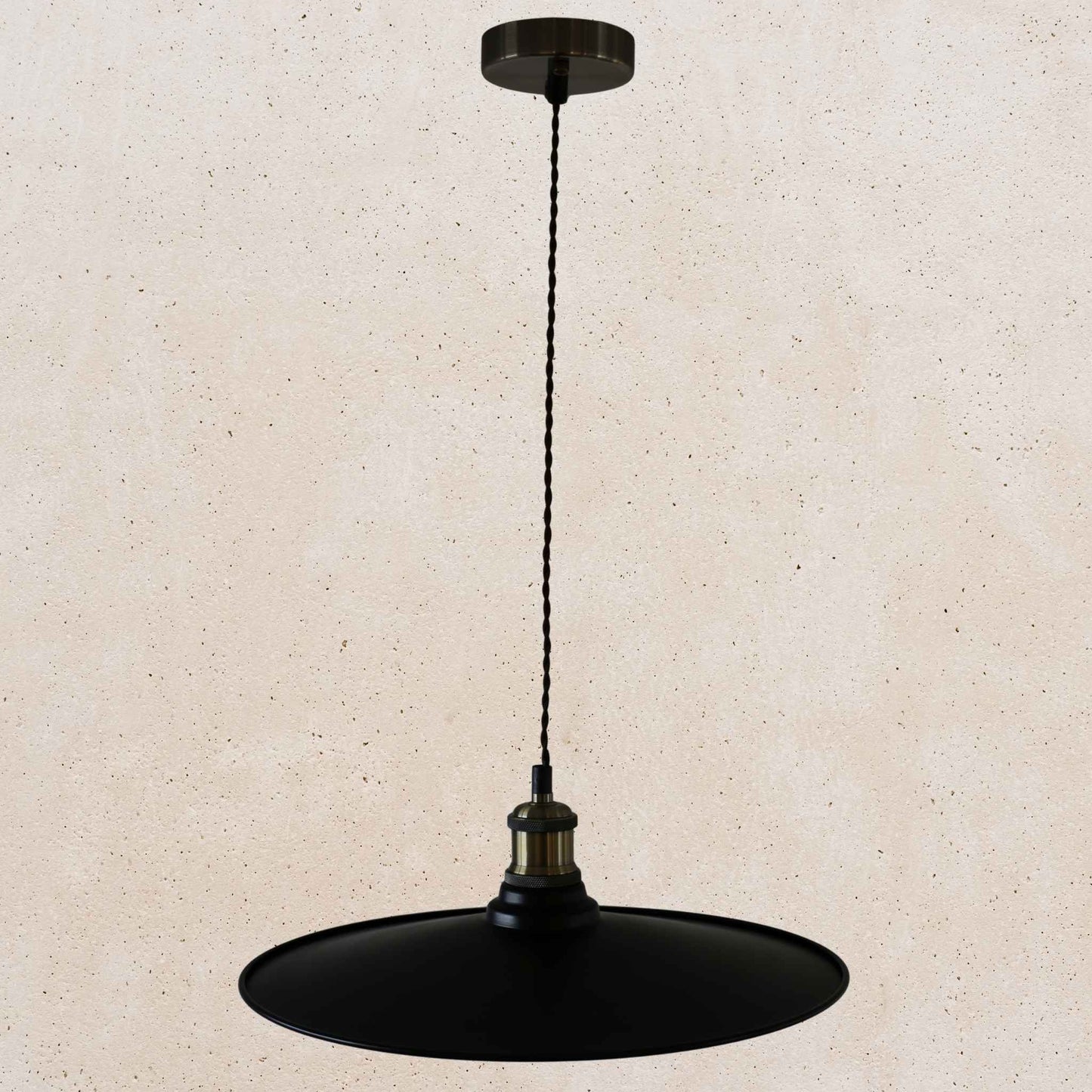 Black pendant light on a beige background