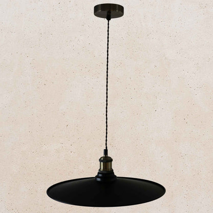 Black pendant light on a beige background