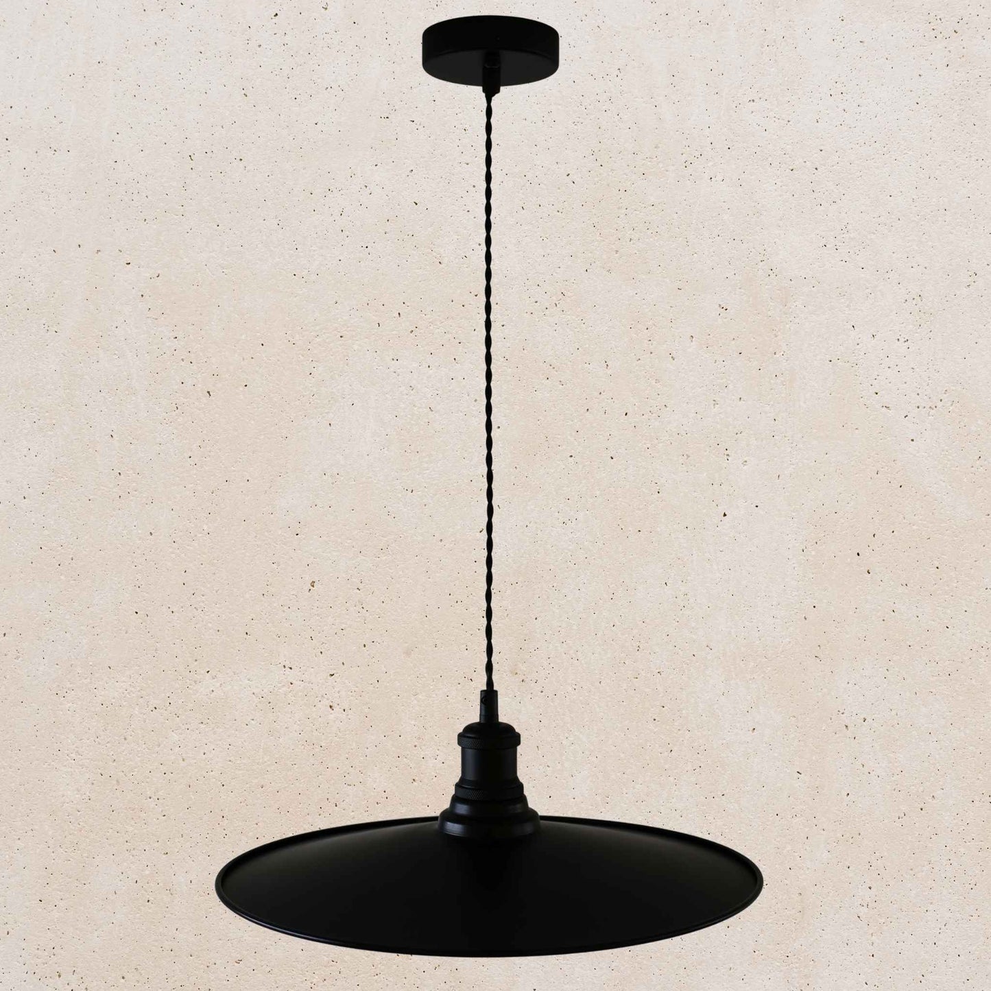 Black pendant light on a beige background