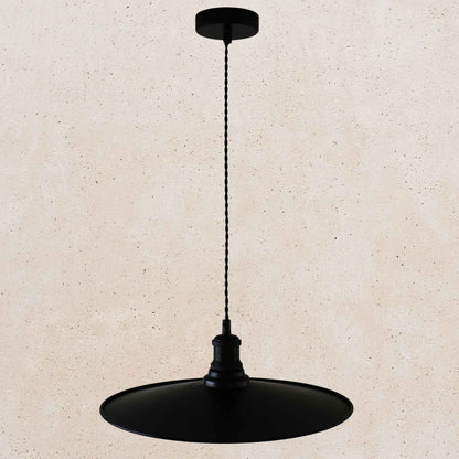 Black pendant light on a beige background